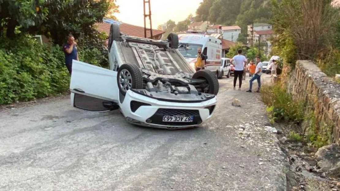 Takla atan araçtan yara almadan kurtuldular